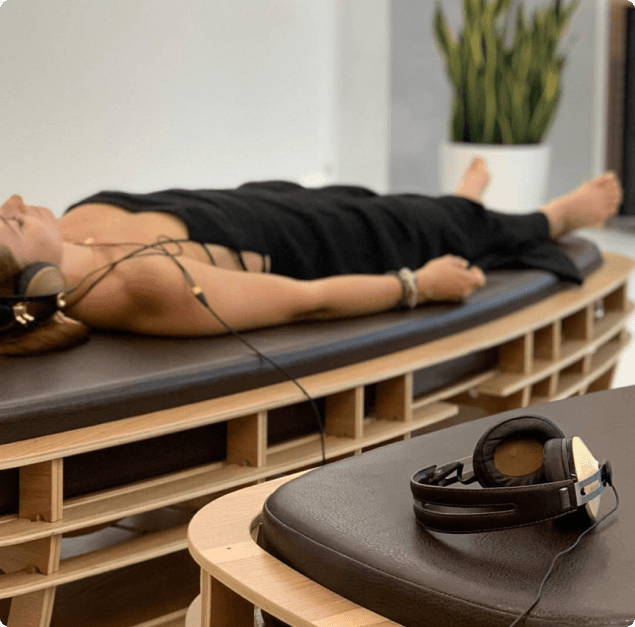 Woman laying on a TUNE device